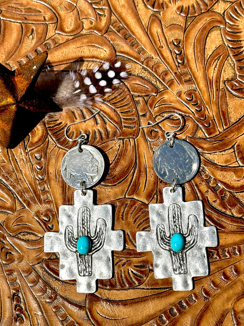 AAA calibrated Kingman turquoise cabochons decorate these darling little silver cactus forms with buffalo nickel topper.
